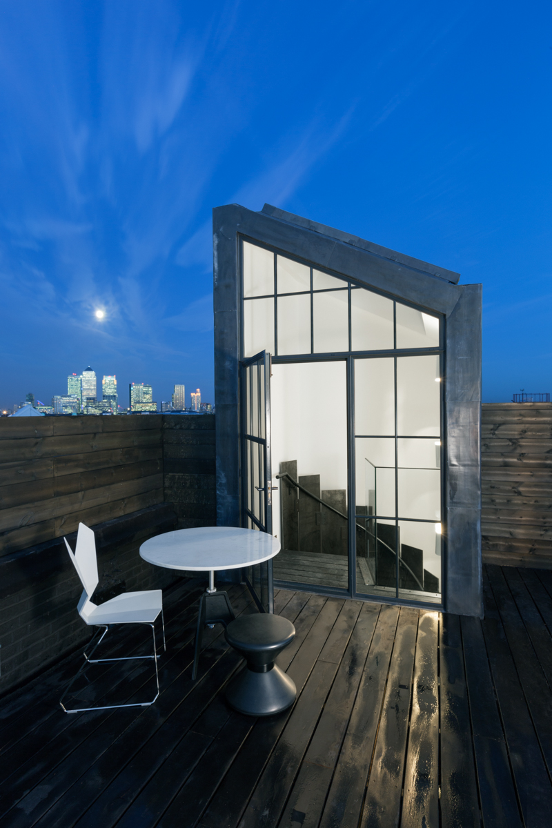 A room with a view. The Metropolitan Wharf penthouse featuring a Tom Dixon Screw table, Y Chair and Drum stool.